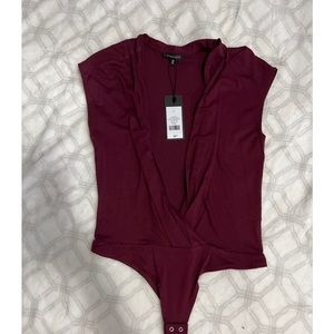 Never worn! Could be adjusted to open deep-c or covered v neck